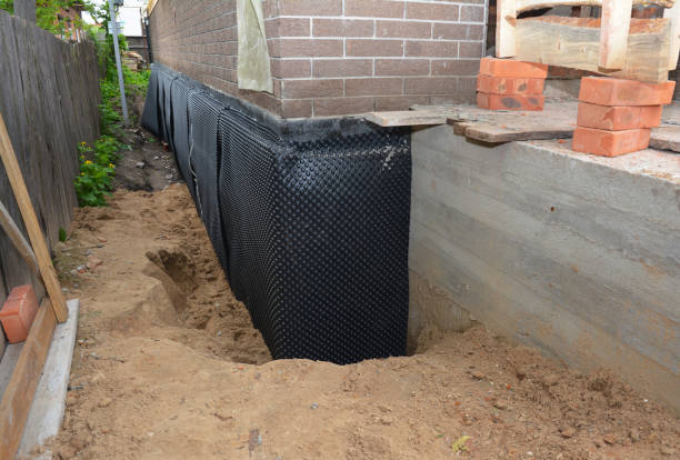 SJ Waterproofing Pros technician performing targeted Emergency Waterproofing assessment in Jasper, IN
